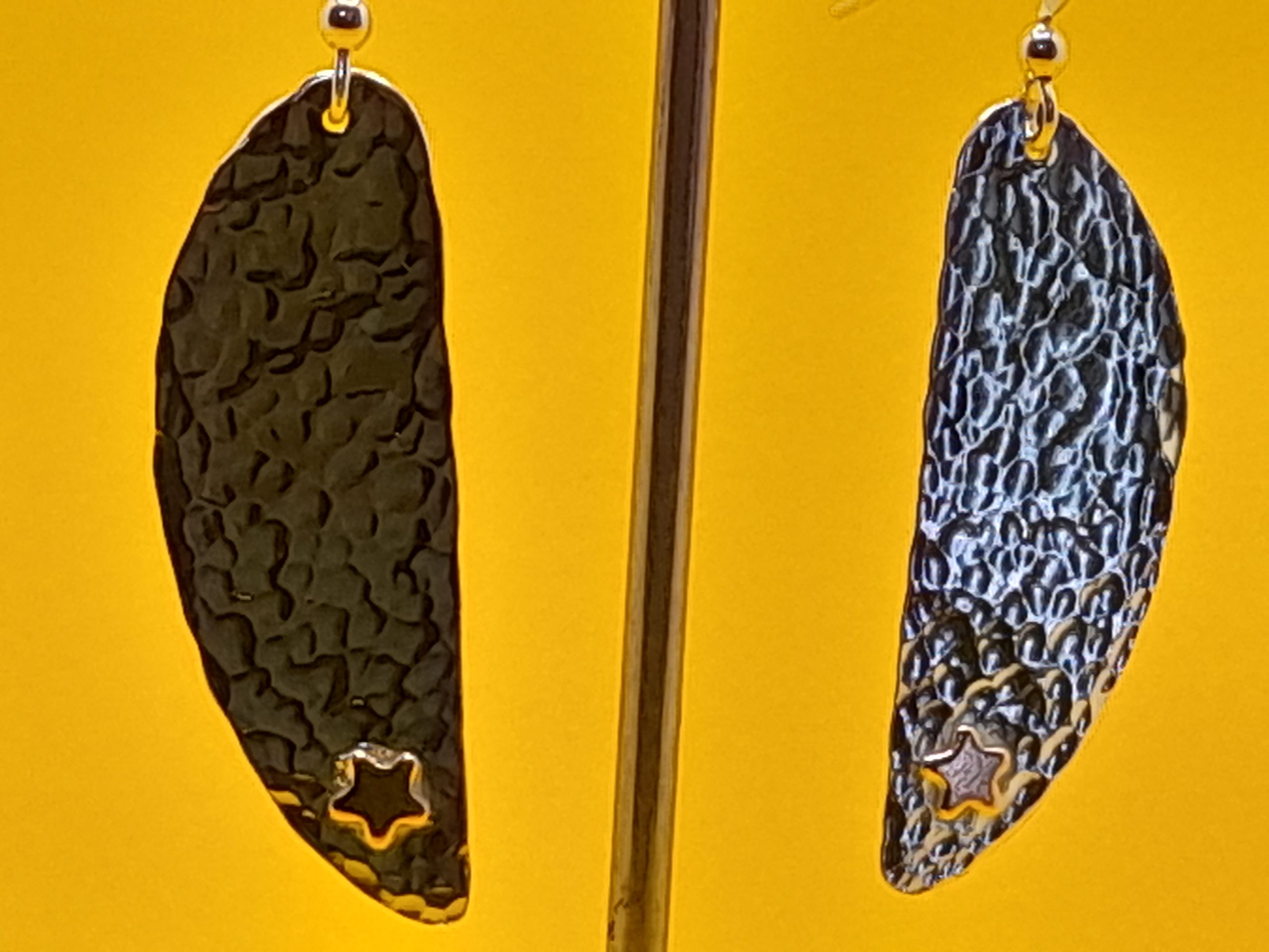 Silver Earrings made from a flatten coffee spoon bowl with added copper stars