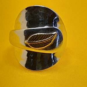 Sterling silver salt spoon ring with a brass leaf on the handle