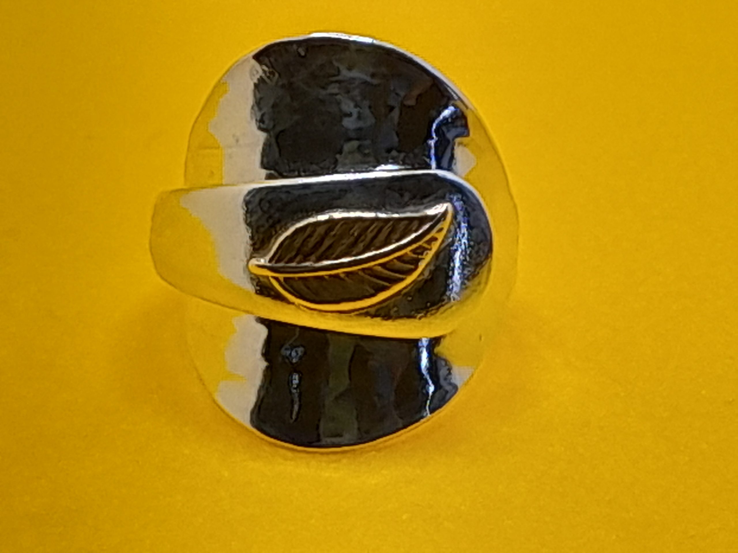 Sterling silver salt spoon ring with a brass leaf on the handle